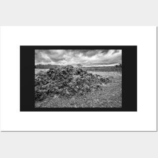 Muck heap in an arable field in the English countryside Posters and Art